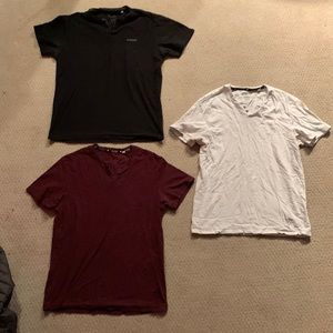 (3) guess v-neck t-shirts.